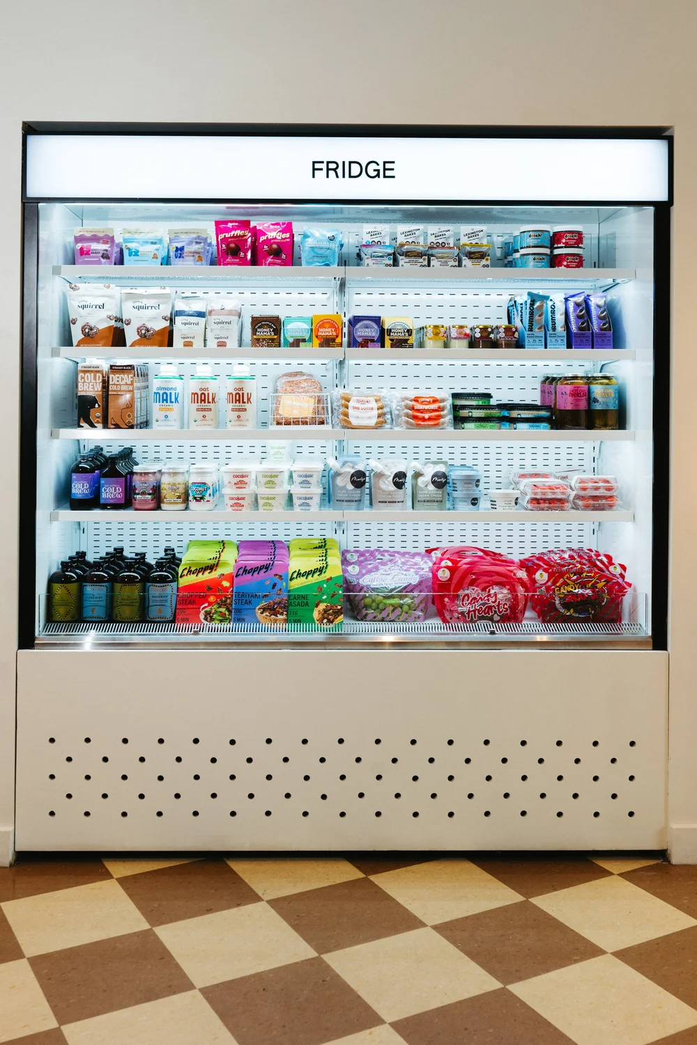Body Coffee bottles lined up on the Pop Up Grocer fridge shelf